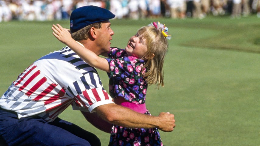 Payne Stewart of the United States hugs his daughter Chelsea after winning the US Open Golf Championship held at the Hazeltine Golf Club in Minnesota on 17th June 1991. He beat Scott Simpson in a playoff. (Photo by Phil Sheldon/Popperfoto via Getty Images/Getty Images)